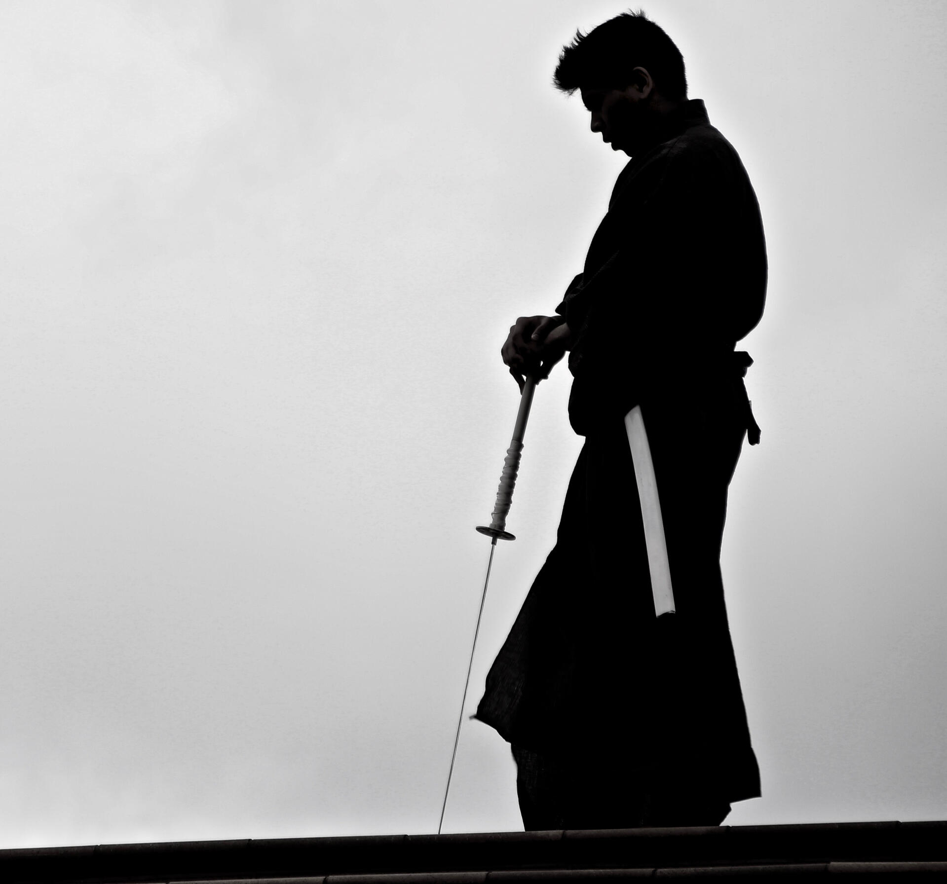 Silhouette of a samurai holding a sword